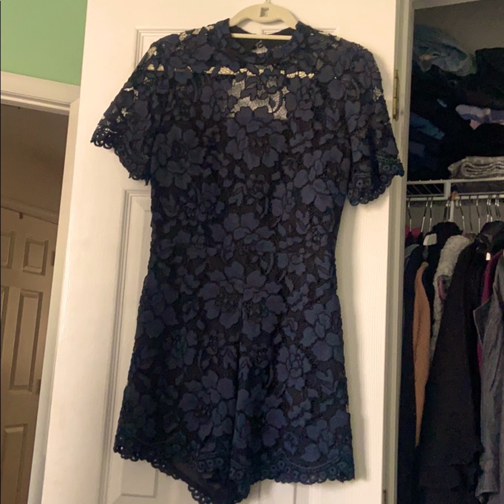 Navy lace open back romper NWT